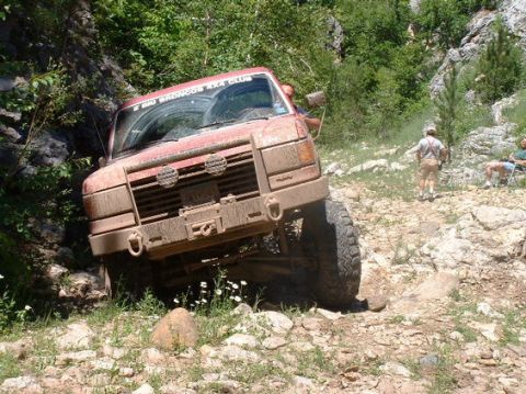1989 Ford Bronco - This 1989 Ford Bronco tackles a challenging off-road course, demonstrating its capabilities.