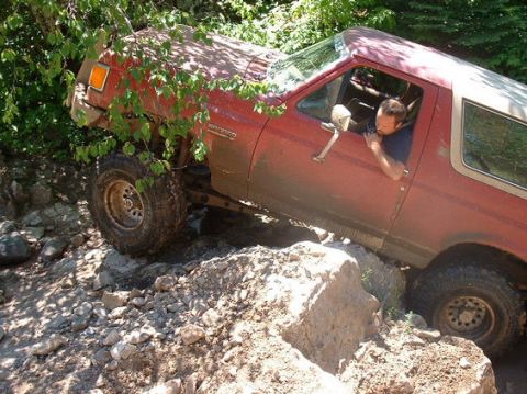 1989 Ford Bronco - This 1989 Ford Bronco is shown off-roading on a challenging rocky path.