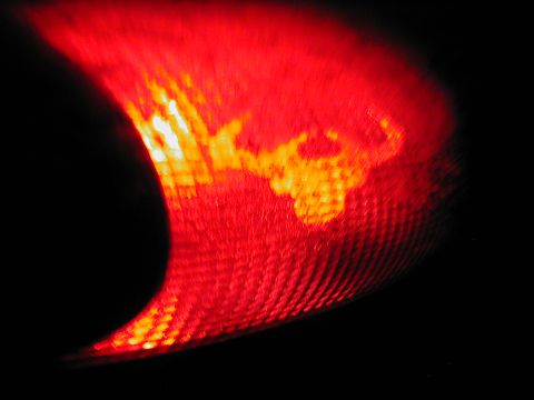1997 Ford Taurus - A scorpion emblem is visible within the red lens of a vehicle's tail light.