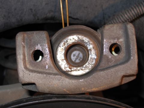 2002 Ford Crown Victoria - Rear caliper with phenolic piston.