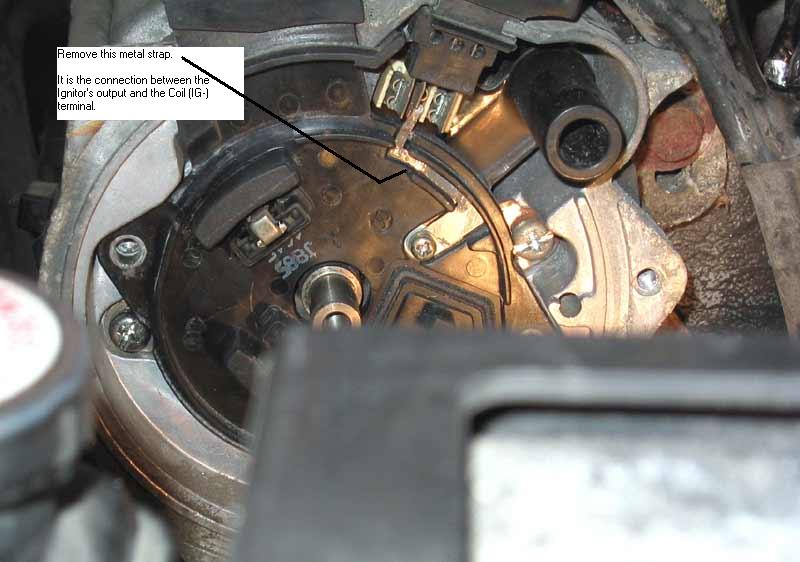 Distributor internals with callout to remove metal strap between igniter and coil terminal
