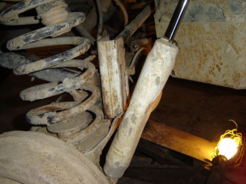 1992 Ford Bronco - Vehicle suspension parts, including a coil spring and shock absorber, are shown in detail.