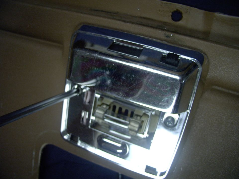 Now you can run in the two screws, making this a true bolt on, not having ruined your original fine corynthian vinyl for future Bronco generations (har har !).