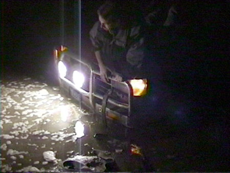 1991 Ford Bronco - Time to hook up the tow strap...can't get at the hooks from this angle. Man, that water's cold!