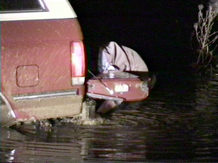 1991 Ford Bronco - Stuck in the water during the winter. Not good. I can't feel my hands in this photo.