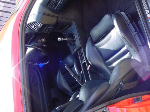 1995 BMW M3 - Interior view of a 1995 BMW M3, highlighting the driver's seat and center console.