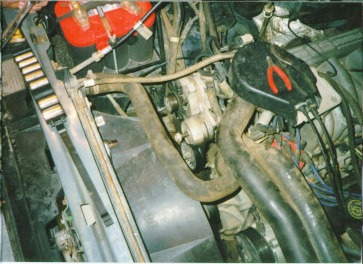 1991 Ford Bronco - Close-up view of an engine compartment, showing various components and wiring.