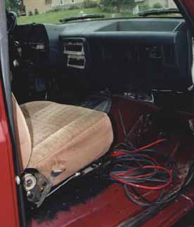 1991 Ford Bronco - Interior view of a 1991 Ford Bronco, with exposed wiring on the floor.