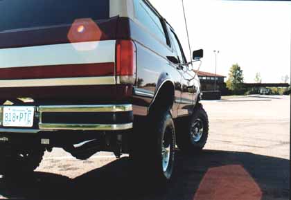 1991 Ford Bronco - Rear view of a 1991 Ford Bronco showing its two-tone paint job and license plate.