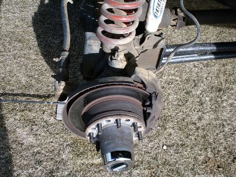 1996 Ford Bronco - Front axle assembly from a Ford Bronco, showing the brake rotor and hub components.