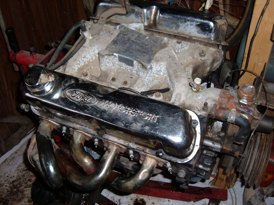 Ford small-block V8 on a stand with chrome Ford Motorsport valve covers and chrome headers