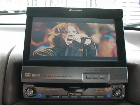 1995 Ford Bronco - Pioneer in-dash multimedia system displays a singer on its screen.