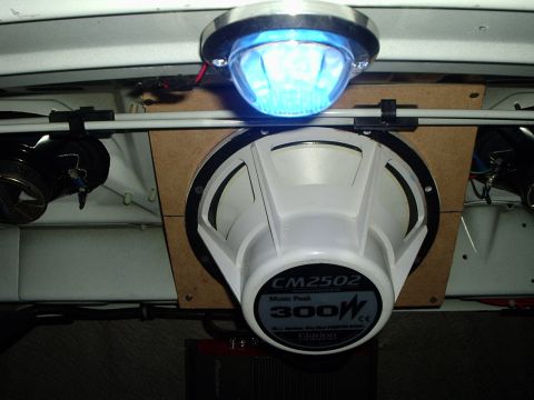 2000 Ford Taurus - Custom car audio setup a large subwoofer and a blue interior light.