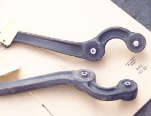 1996 Ford Bronco - Two suspension control arms are shown, likely for a vehicle's front suspension system.