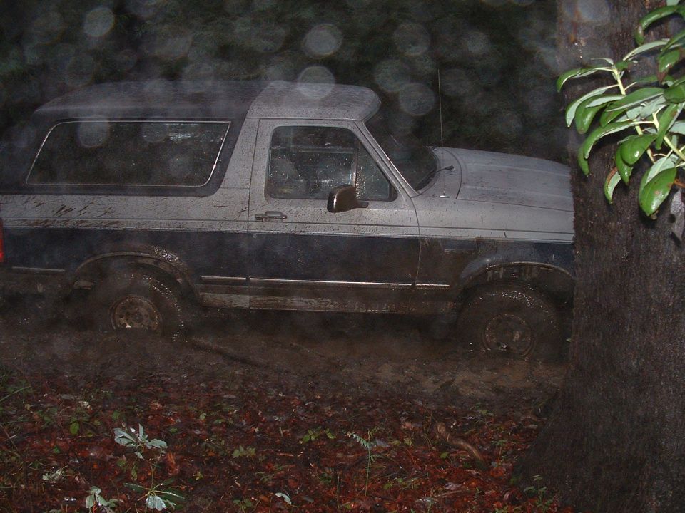 1990 Ford Bronco stuck in mud off-road