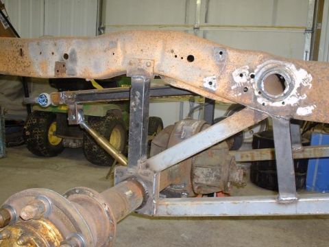 1978 Ford F-350 - Close-up view of a truck frame and rear axle, showing structural components and signs of wear.