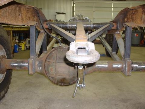 1978 Ford F-350 - Close-up of a truck's rear axle and frame, showing custom fabrication work.