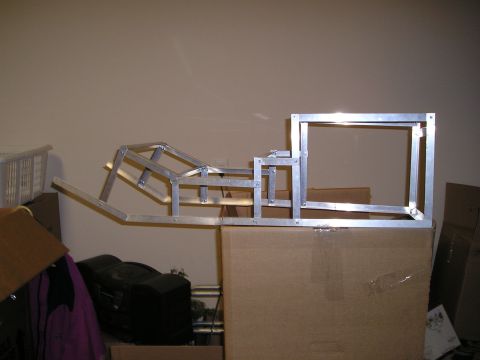 1996 Ford Bronco - Unidentified aluminum frame structure, likely a custom part, is shown in a workshop setting.