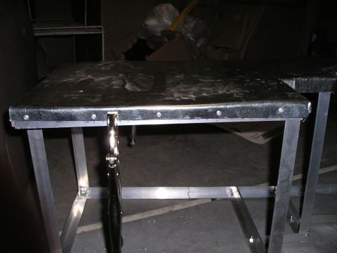 1996 Ford Bronco - A custom center console, likely for a vehicle, is shown with a metal frame and a clamp attached.