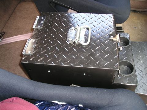 1996 Ford Bronco - A custom center console unit, made of diamond plate metal, is shown installed in a vehicle's interior.