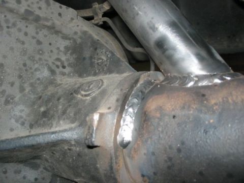 1995 Ford Bronco - This image shows a close-up view of a rear axle housing with fresh welds on a pipe attached to it.