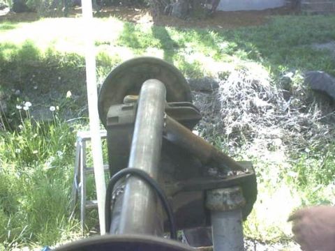 1995 Ford Bronco - Close-up view of a vehicle's suspension part, possibly a shock absorber assembly.
