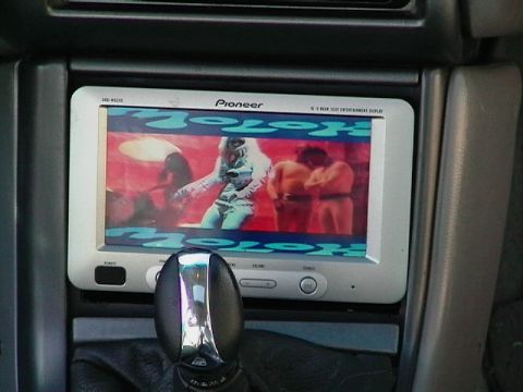 1995 Ford Contour - Interior view of a car's dashboard with a Pioneer entertainment display and gear shifter.