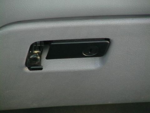 1995 Ford Contour - Interior shot of a vehicle's glove box latch.