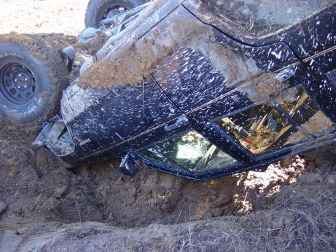 1983 Ford Bronco - SUV stuck in a ditch after an off-road incident.