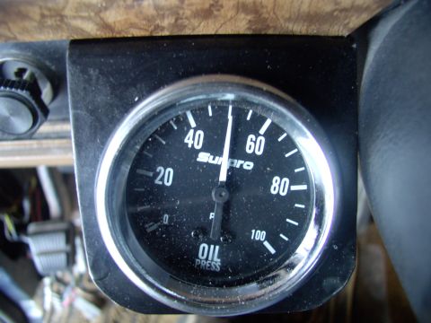 1986 Ford Bronco - Here's the gauge in place, but needing dusted.