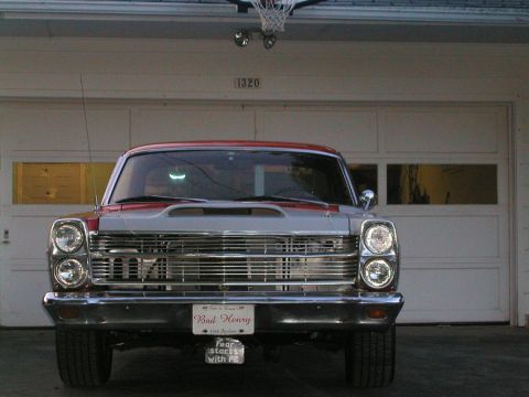 1966 Ford Fairlane - Front view of a 1966 Ford Fairlane, a custom "Bad Henry" license plate and a prominent hood scoop.