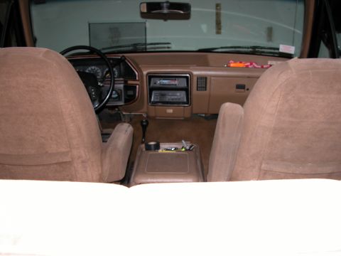 1989 Ford Bronco - Interior view of a 1989 Ford Bronco, the dashboard, seats, and center console.