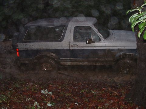 1991 Ford Bronco - This two-tone Ford Bronco navigates a muddy off-road trail.