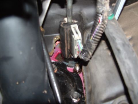 1990 Ford Bronco - This image shows a close-up view of electrical wiring and connectors within a vehicle's interior.