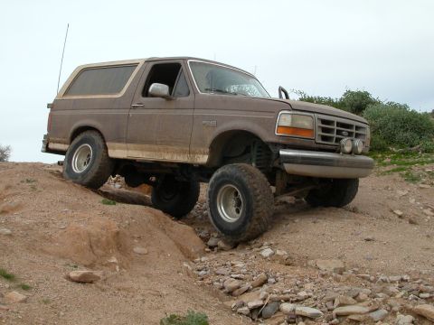 1993 Ford Bronco - This 1993 Ford Bronco is shown navigating a challenging off-road terrain.