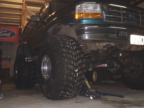 1996 Ford Bronco - This 1996 Ford Bronco is shown with massive off-road tires and is supported by a jack.