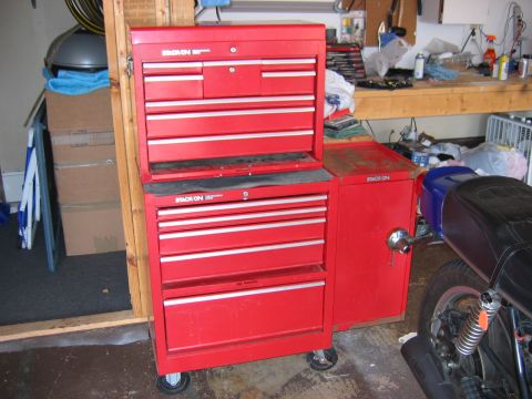 1985 Ford LTD Crown Victoria - A red Stack-On tool chest is visible in a garage, alongside parts of a motorcycle and a workbench.