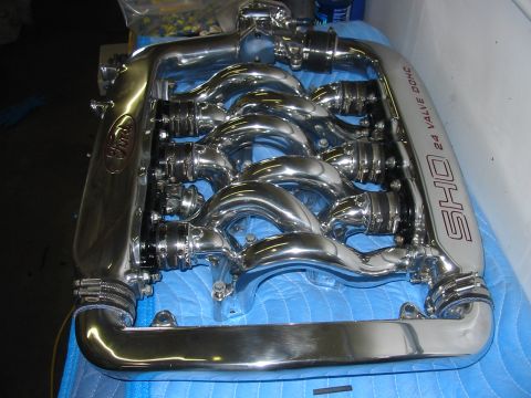 1993 Ford Taurus - A polished chrome intake manifold with Ford and SHO 24 valve DOHC branding is shown.