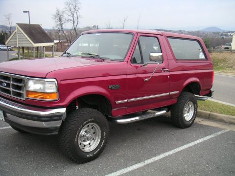1994 Ford Bronco - This 1994 Ford Bronco is shown in a parking lot with a mountainous background.