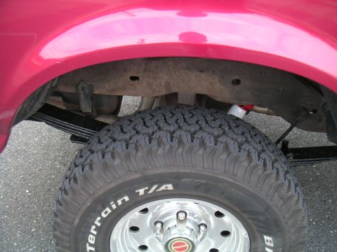 1994 Ford Bronco - Close-up of the rear wheel and suspension system on a 1994 Ford Bronco.