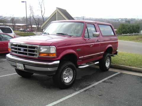 1994 Ford Bronco - This lifted 1994 Ford Bronco is shown in a three-quarter front view, parked in a lot.