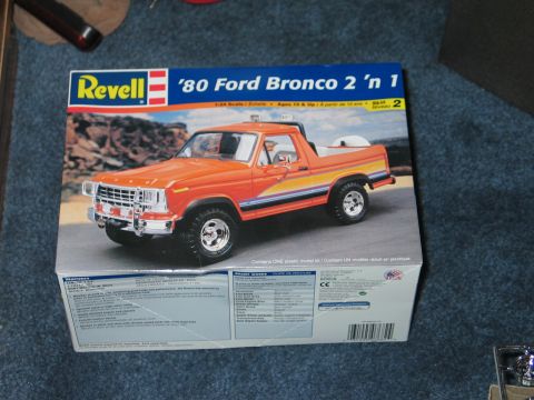 1995 Ford Bronco - Box art for a Revell '80 Ford Bronco 2 'n 1 model kit shows an orange truck.