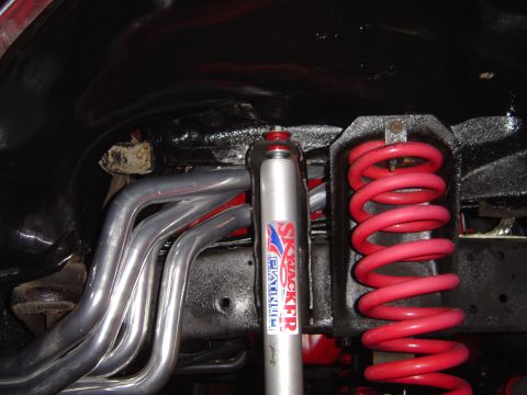 1978 Ford Bronco - Custom suspension and exhaust parts are visible on this vehicle's undercarriage.