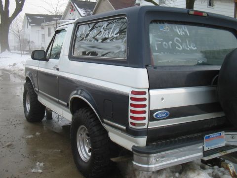 1992 Ford Bronco - Rear view of a 1992 Ford Bronco XLT with "For Sale" written on the windows.
