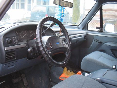 1992 Ford Bronco - Interior view of a 1992 Ford Bronco XLT, highlighting the dashboard and seating.