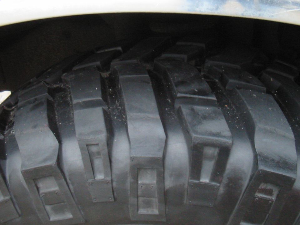 Close-up of aggressive off-road tire tread pattern