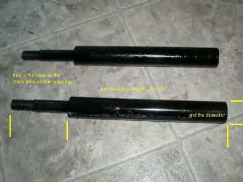 1979 Ford Bronco - Two black shock absorbers are shown with yellow markings indicating length and diameter, with text discussing stock arms and desired length.