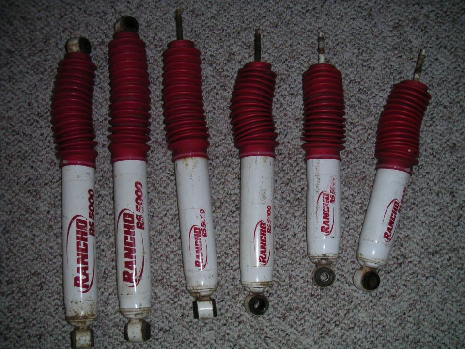 Six Rancho RS 5000 shock absorbers with red bellows