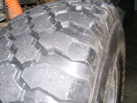1978 Ford Bronco - Off-road tire tread detail, with some sidewall text visible.