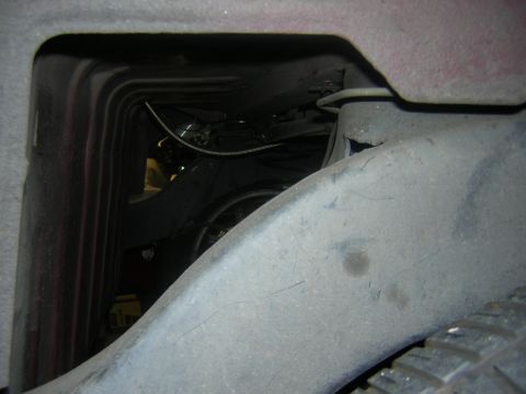 1992 Ford Crown Victoria - A view into the engine bay reveals suspension parts and the wheel well area.